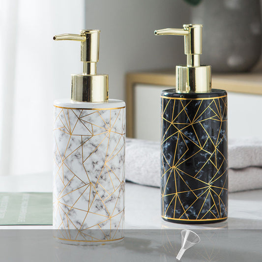 Elegant bathroom accessory with gold pump for soap or lotion, placed on a modern minimalistic background.